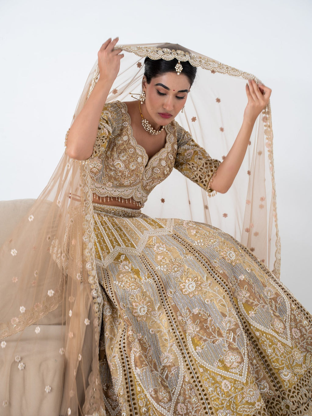 Antique gold cutwork lehenga, full length with the dupatta