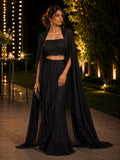Black ruffled palazzo co-ord with long sheer cape