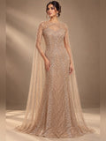 Champagne embellished gown with sheer cape sleeves