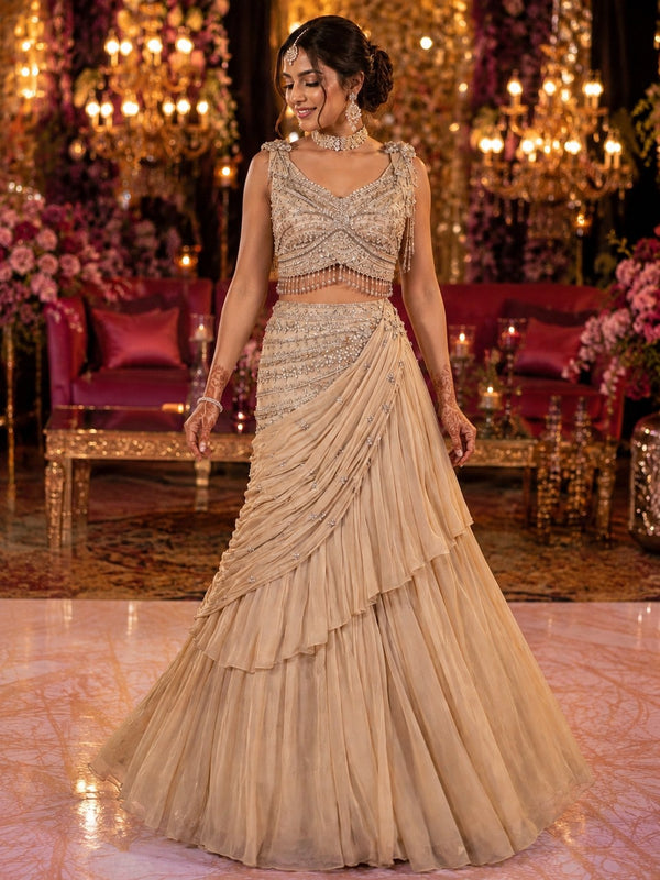 Champagne ruffled tiered drape saree with embellished blouse