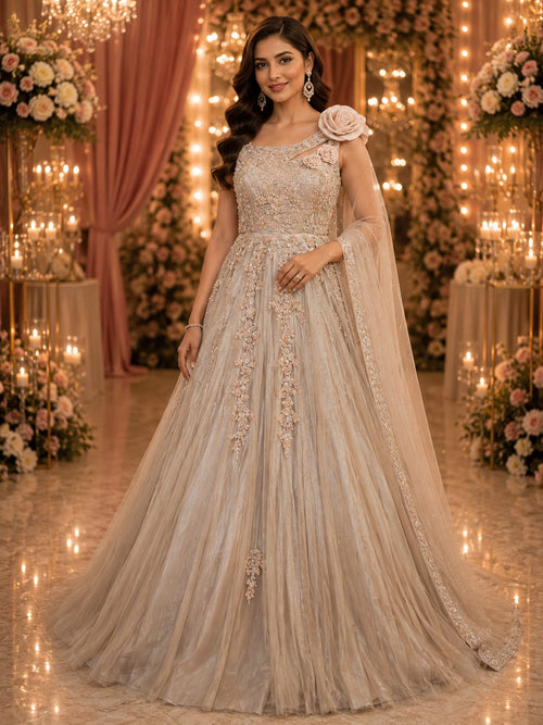 Champagne tulle ball gown with floral sequin work and one-shoulder rosette
