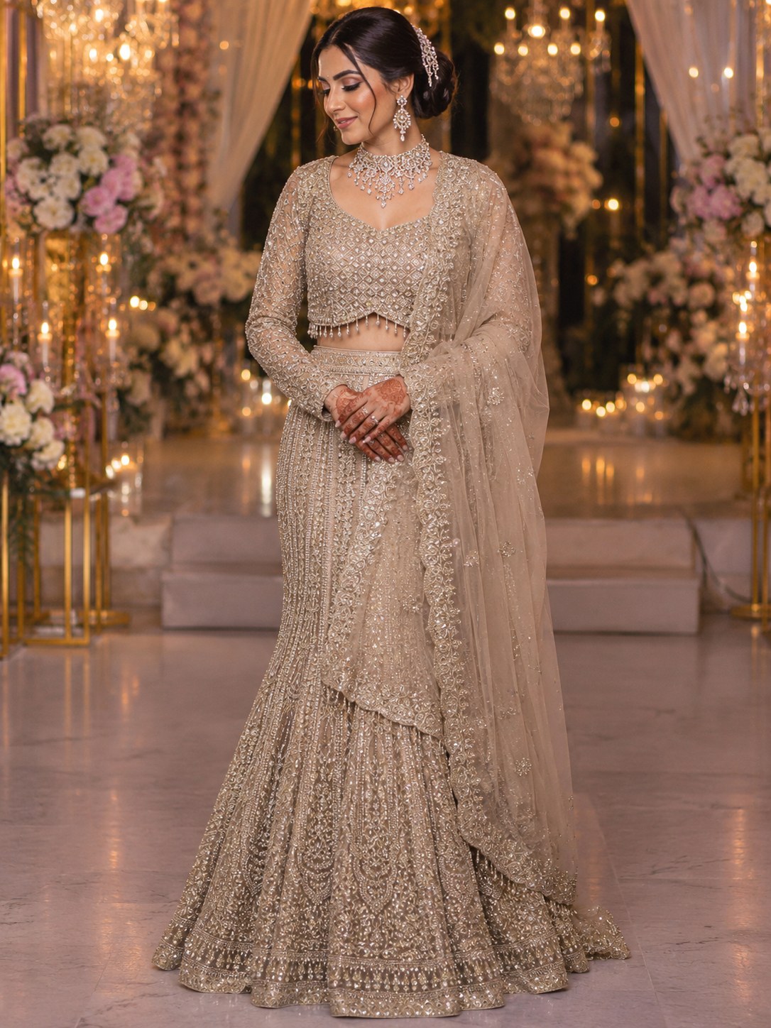Champagne lehenga with heavy zardozi and attached shoulder drape