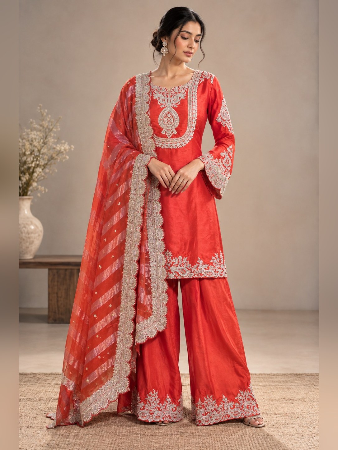 Coral sharara suit with gold zari border