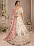 Ivory raw silk lehenga with peacock zardozi motifs and blush pink tissue dupatta