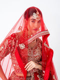Red velvet bridal lehenga, with the dupatta worn as a veil