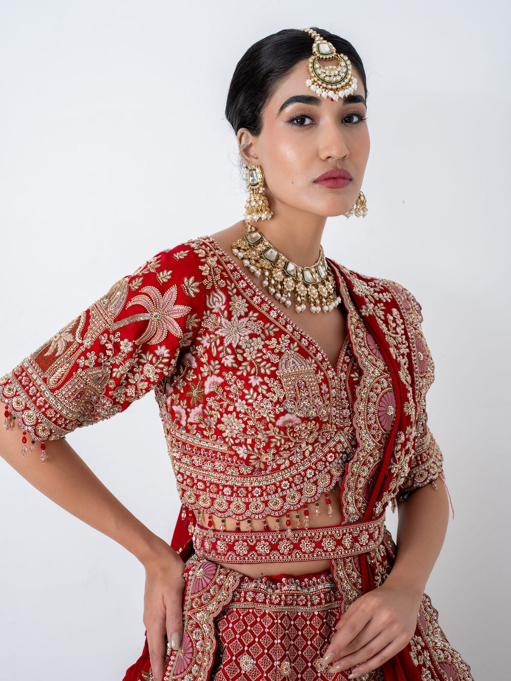 Red velvet bridal lehenga, blouse and neckline