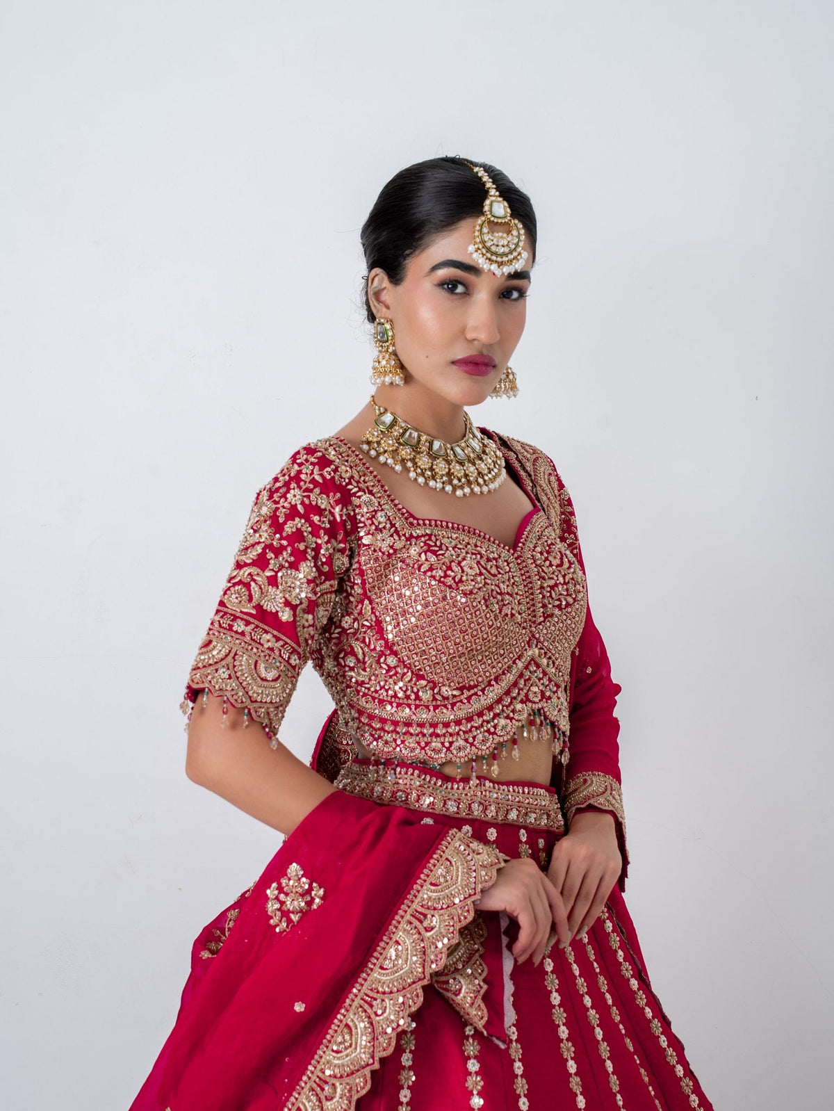 Red zari floral lehenga, waist up