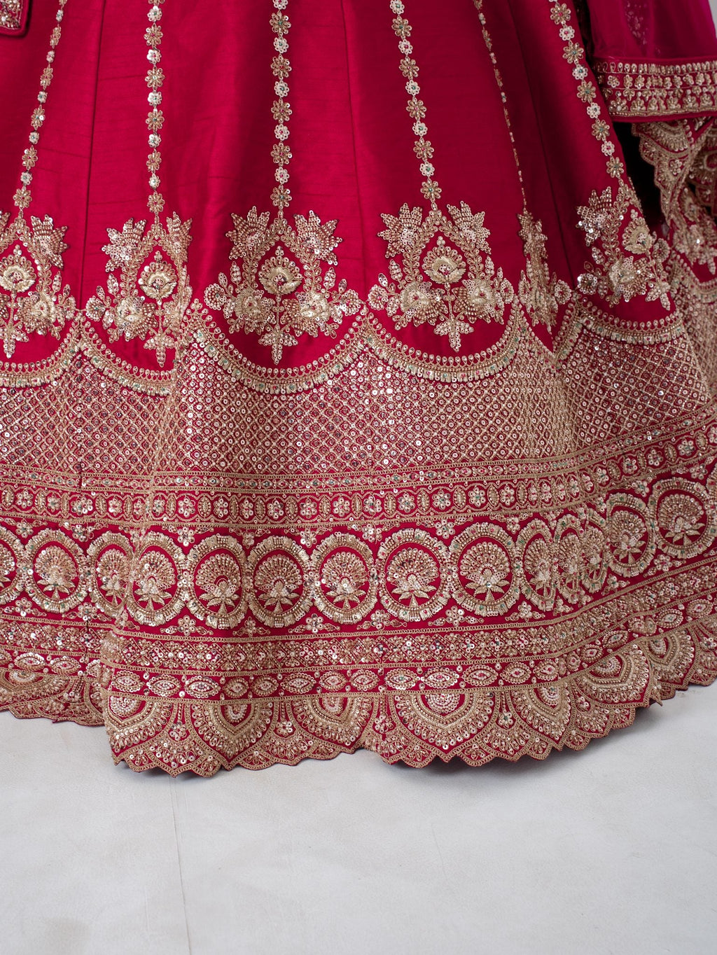 Red zari floral lehenga, hem close-up