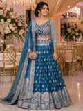 Teal blue lehenga with silver zari buti and heavy border