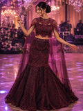 Wine fishtail lehenga with attached sheer cape